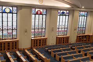 Kehillath Israel Temple interior with stain glass windows